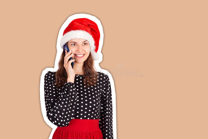 Attractive woman talking on mobile phone with friend. emotional girl in santa claus christmas hat Magazine collage style with stock image Attractive woman talking on mobile phone with friend. emotional girl in santa claus christmas hat Magazine collage style with stock image