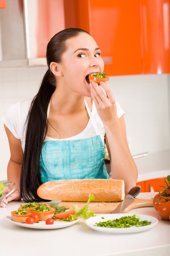 Attractive woman tasting fresh healthy sandwiches