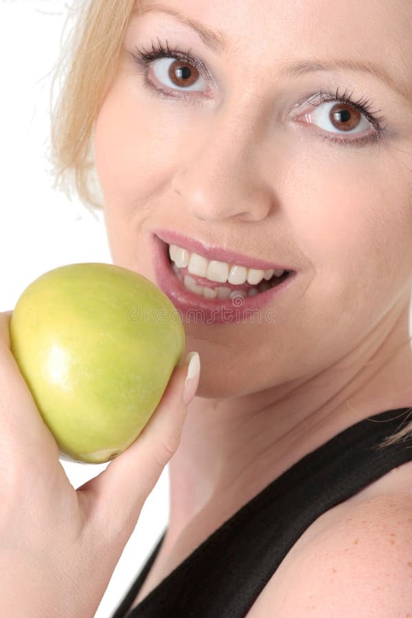 Attractive woman about to eat an apple