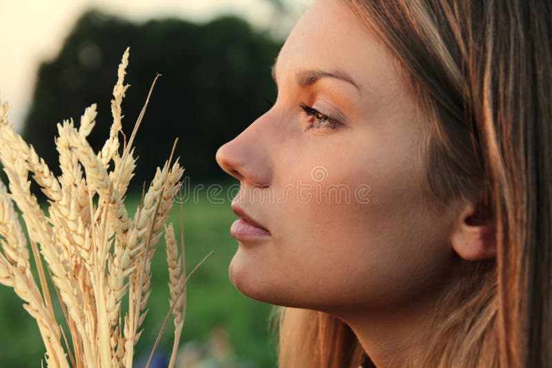 Attractive Woman with wheat spikes