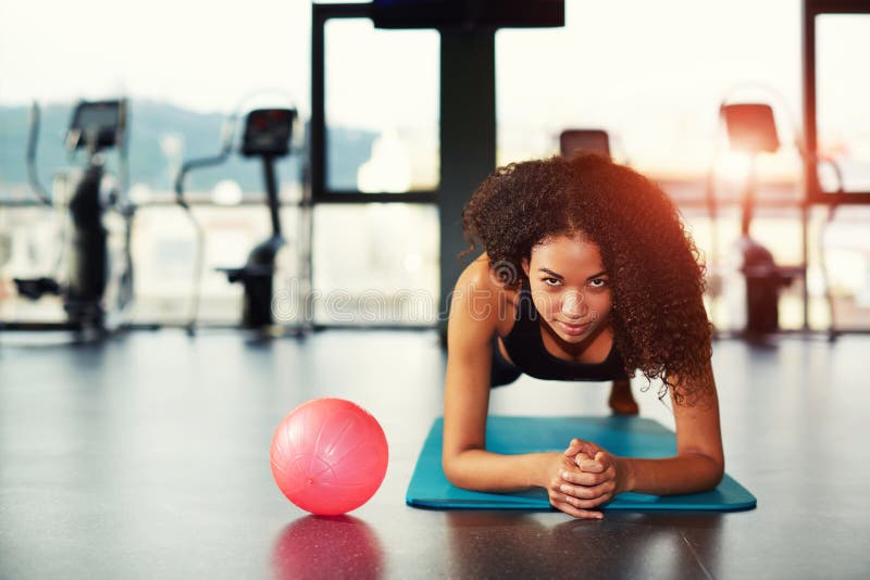 Attractive woman working out with abdominal muscles at gym stock image Attractive woman working out with abdominal muscles at gym stock image
