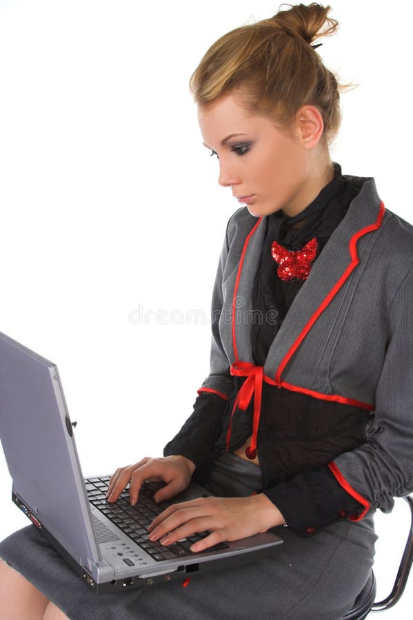 Attractive young business woman sitting on bar chair and working