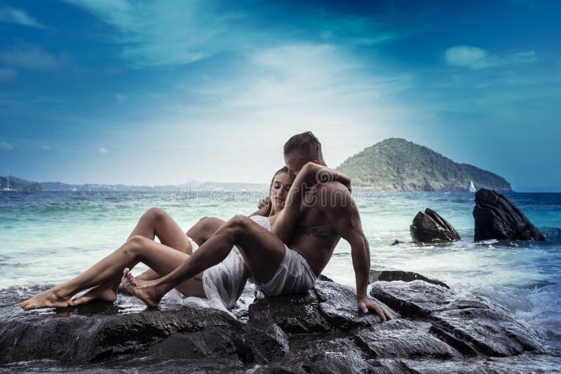 Attractive young couple by the sea