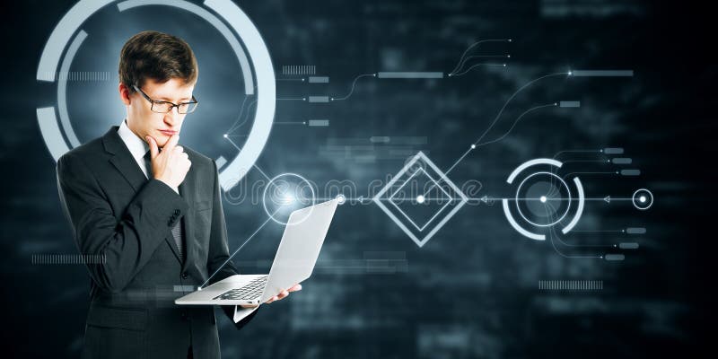 Attractive young eueopean businessman using laptop on abstract blurry background with digital business interface. Technology stock photography
