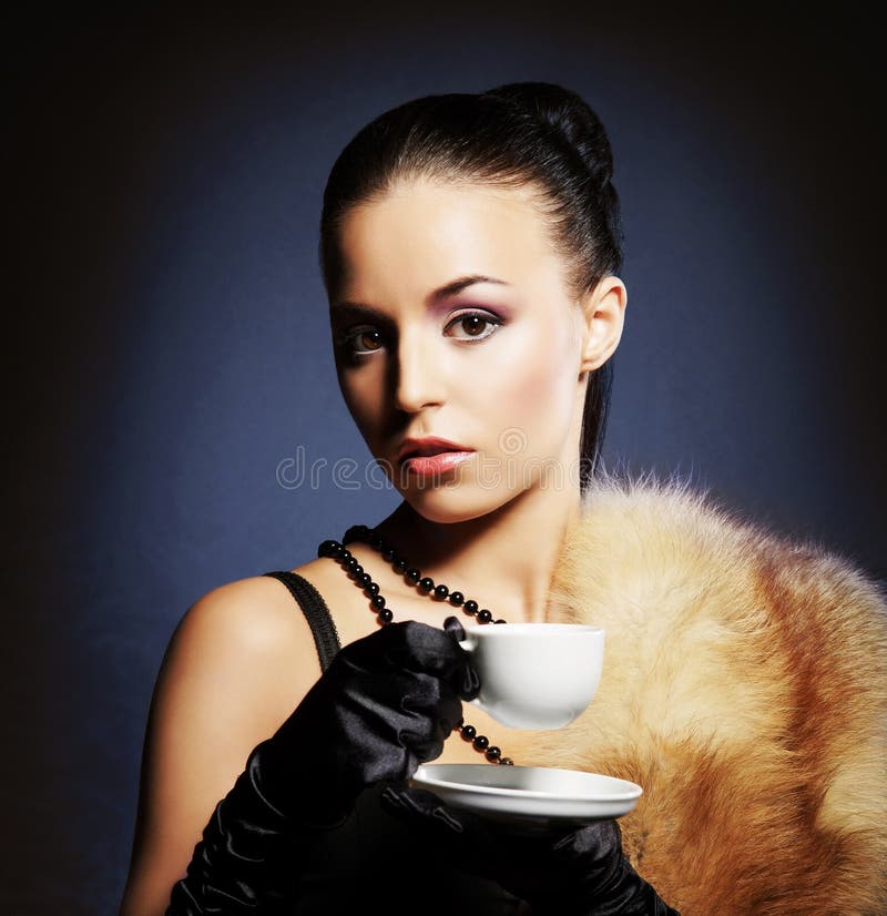 Attractive young lady with the coffee mug