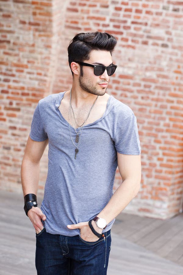 Attractive young male model posing outdoors stock photography