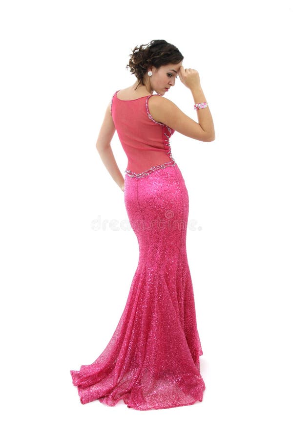 Attractive young woman in elegant pink dress