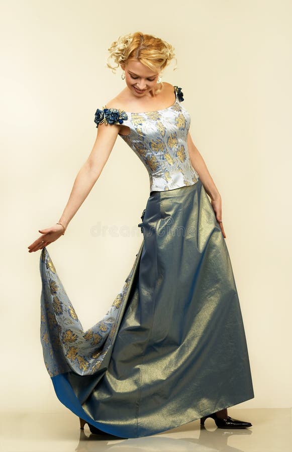 Beautiful young woman in evening dress. Beautiful young woman in evening dress.