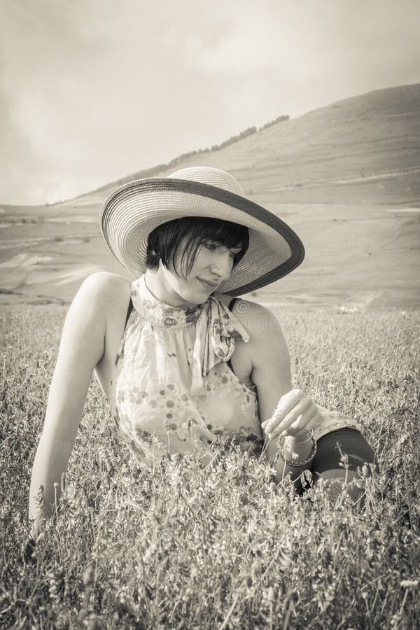 Attractive young woman lying on grass