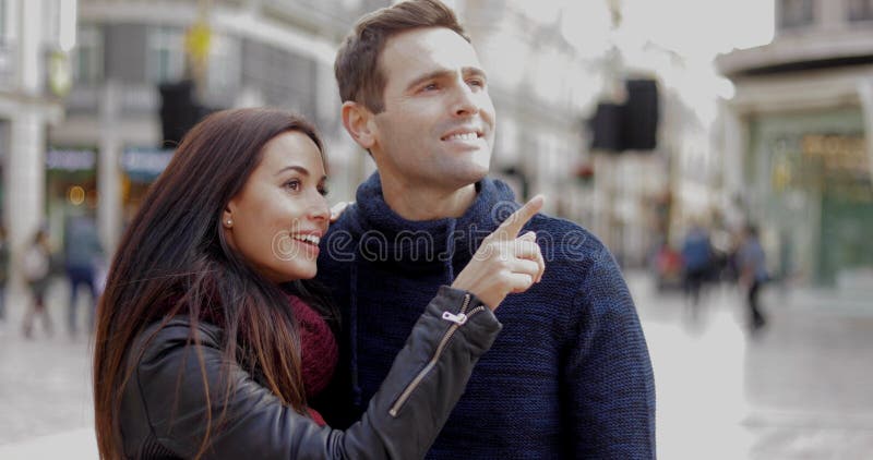 Attractive young woman pointing out something stock images Attractive young woman pointing out something stock images