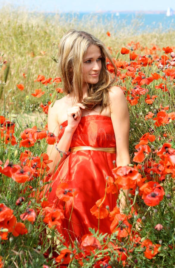 Attractive young woman in red dress