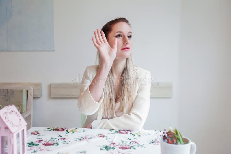 Attractive Young Woman in the Restaurant Calling Waiter Stock Image