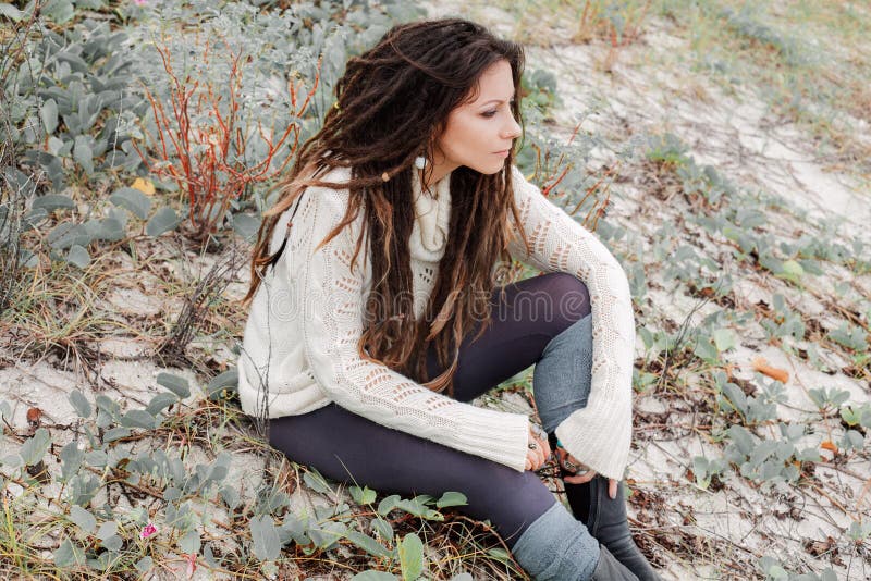 Attractive young woman in white sweater outdoors royalty free stock image Attractive young woman in white sweater outdoors royalty free stock image