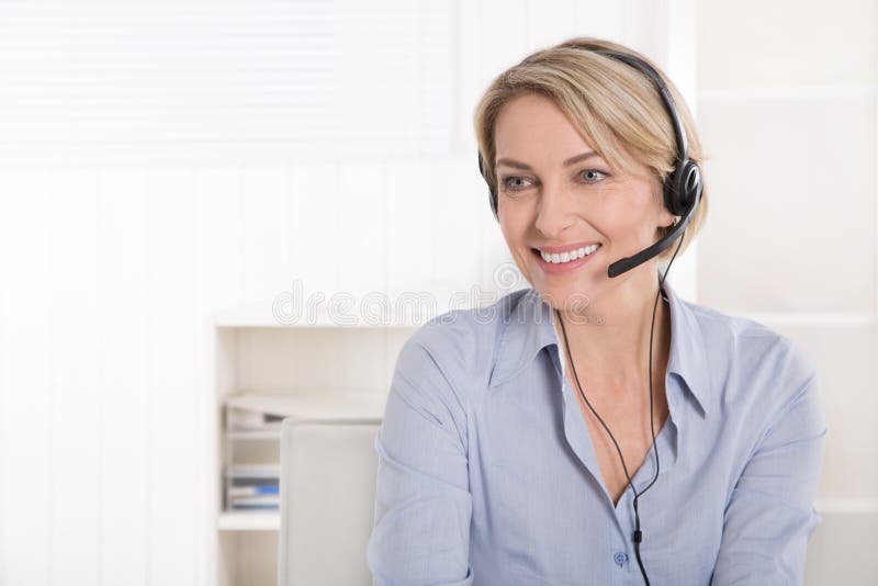 Smiling woman with headphone on telesales. Smiling woman with headphone on telesales.
