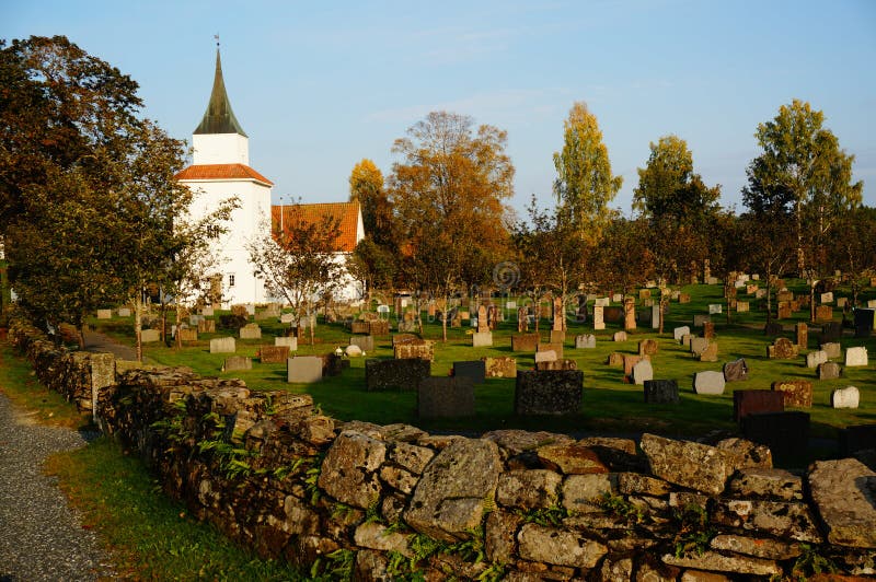 Atumn on norwegian cemetery and church, Norway