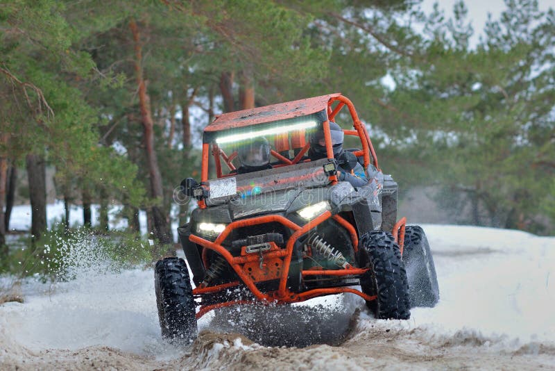 ATV and UTV Driving in Mud and Snow at Winter Stock Photo Image of