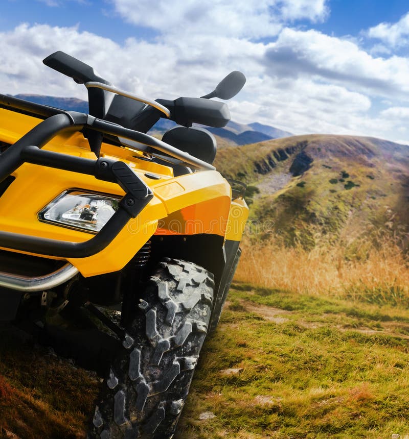 Atv vehicle standing on a mountain landscape offroad trail angle view royalty free stock photo Atv vehicle standing on a mountain landscape offroad trail angle view royalty free stock photo