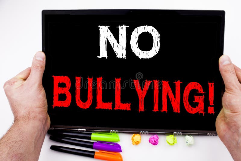 No Bullying written on tablet, computer in the office with marker, pen, stationery. Business concept for Bullies Prevention Against School Work or Cyber Internet Harassment white background space. No Bullying written on tablet, computer in the office with marker, pen, stationery. Business concept for Bullies Prevention Against School Work or Cyber Internet Harassment white background space