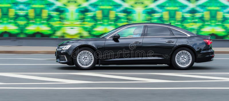 Audi A6 Sedan Driving on Moscow Streets. Black Audi A6 55 TFSI Quattro Motion, Side View Editorial Photography - Image of luxury: 230952537