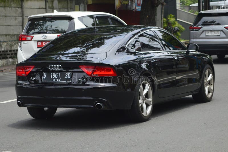 A black sedan 2014 Audi A7 3.0T on the streets in Medan, North Sumatra, Indonesia &#x28;Apr 3, 2024&#x29;. A black sedan 2014 Audi A7 3.0T on the streets in Medan, North Sumatra, Indonesia &#x28;Apr 3, 2024&#x29;.