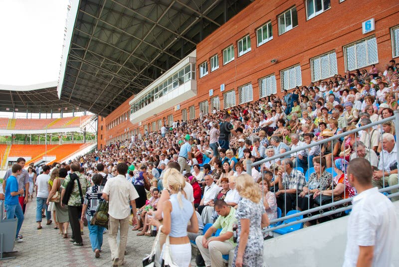 The audience in the stands at a football match