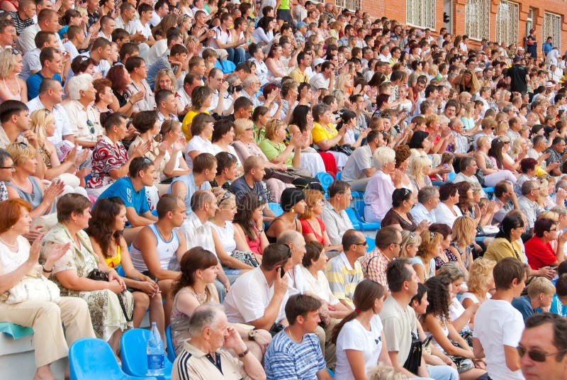 The audience in the stands at a football match