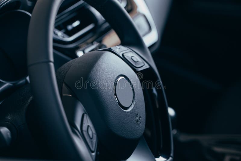 Audio Control Buttons on the Steering Wheel of a Modern Car Stock Image