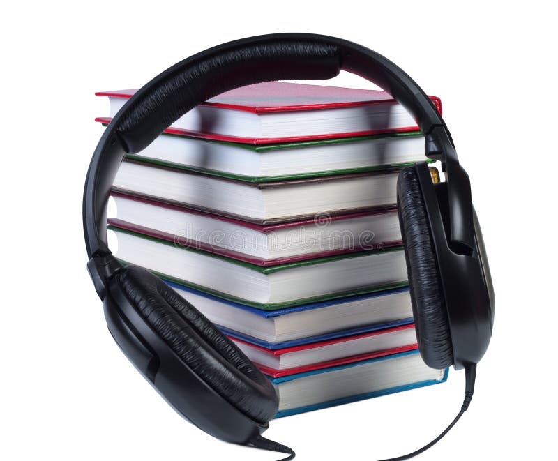 Audio headphones on a pile of books with color covers.