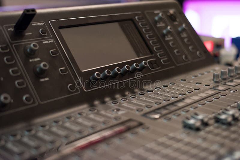 Audio sound mixer console. Audio mixer, music equipment. broadcasting tools, mixer, synthesizer. and computer control. Professional sound and audio mixer control panel with buttons and sliders.