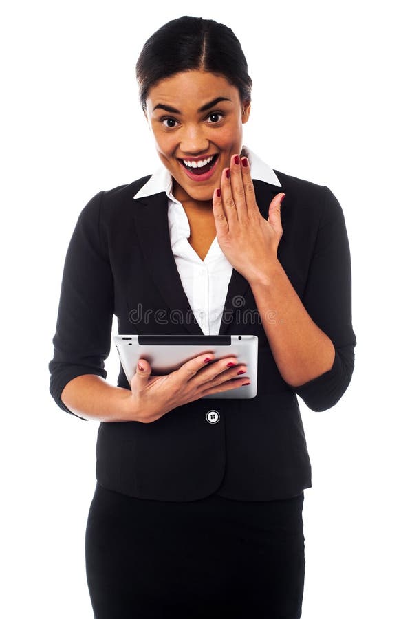 Businesswoman holding touch pad. Excited about winning online game. Businesswoman holding touch pad. Excited about winning online game