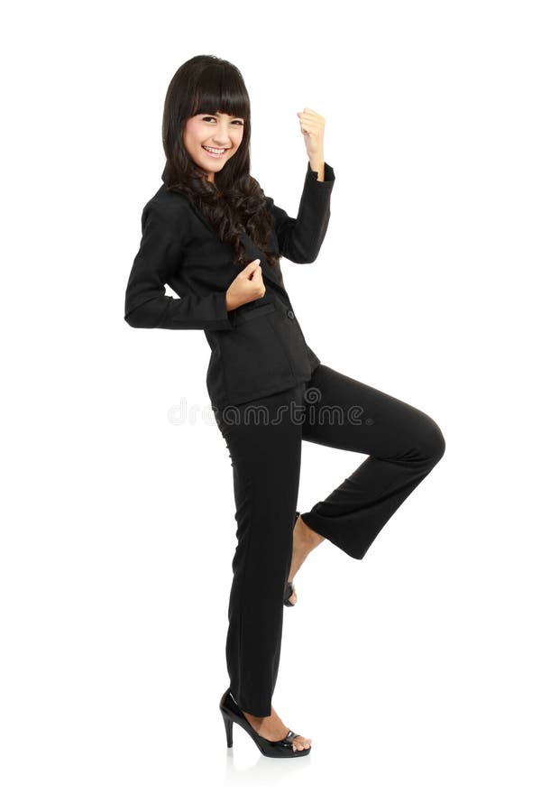 Excited happy asian business woman isolated in full length on white background. Excited happy asian business woman isolated in full length on white background.