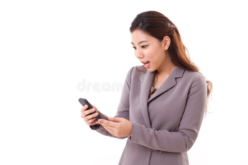 Excited, surprised business woman looking at her mobile phone, hand holding smartphone. Excited, surprised business woman looking at her mobile phone, hand holding smartphone