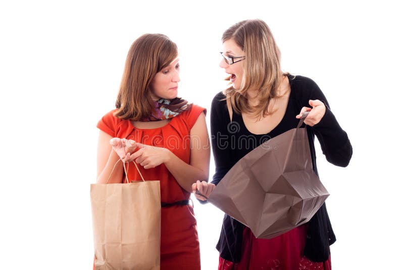 Two young happy excited women shopping, isolated on white background. Two young happy excited women shopping, isolated on white background.