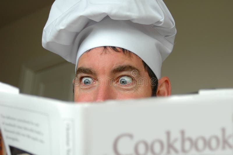 A cook is excited about a recipe in a cookbook. MODEL RELEASE IS UPLOADED!!! I'd appreciate hearing how you use(d) my image(s). A cook is excited about a recipe in a cookbook. MODEL RELEASE IS UPLOADED!!! I'd appreciate hearing how you use(d) my image(s).