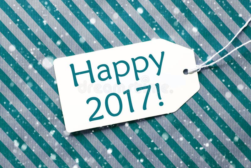 One Label On A Turquoise Striped Wrapping Paper. Textured Background With Snowflakes. Tag With Ribbon. English Text Happy 2017 For Happy New Year Greetings. One Label On A Turquoise Striped Wrapping Paper. Textured Background With Snowflakes. Tag With Ribbon. English Text Happy 2017 For Happy New Year Greetings