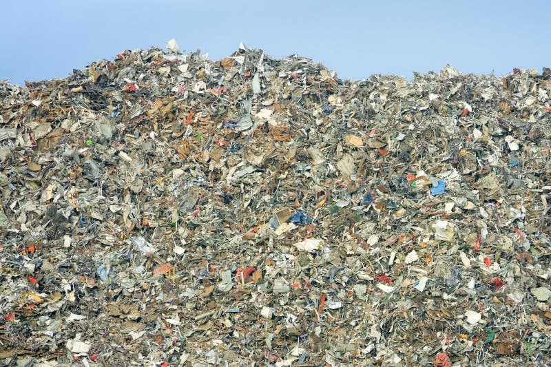 Massive pile of decomposing landfill garbage - no visible trademarks. Massive pile of decomposing landfill garbage - no visible trademarks