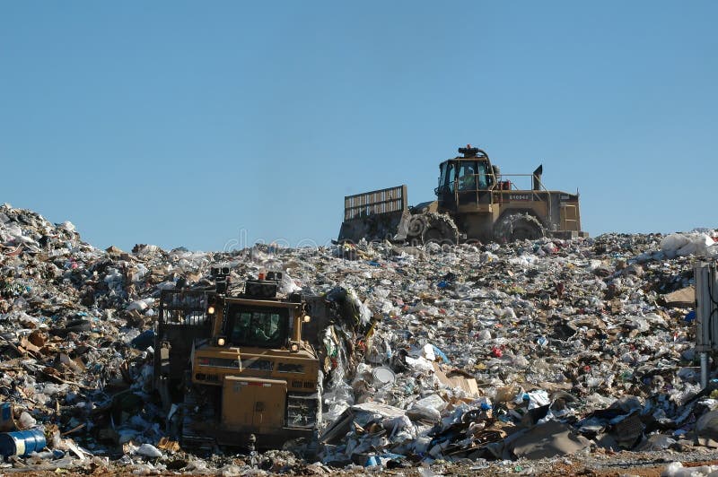 Dozer and compactor operating at landfill. Dozer and compactor operating at landfill