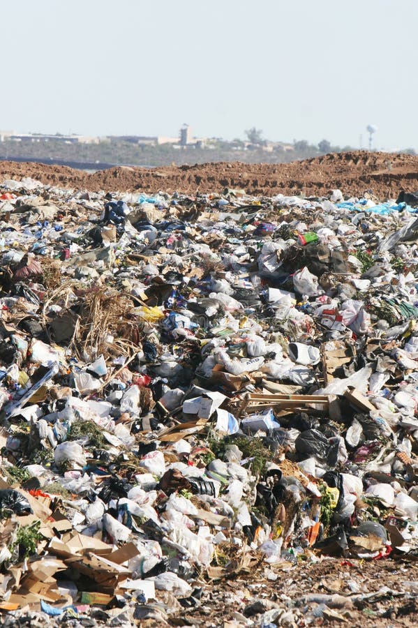 A giant mound of trash in a landfill. All trademarks and logos digitally removed. A giant mound of trash in a landfill. All trademarks and logos digitally removed.