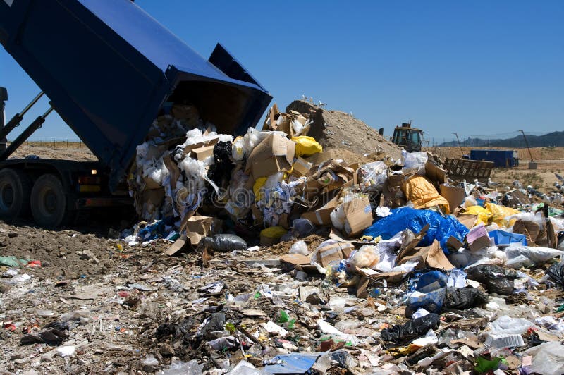 Truck dumping trash in landfill. Truck dumping trash in landfill