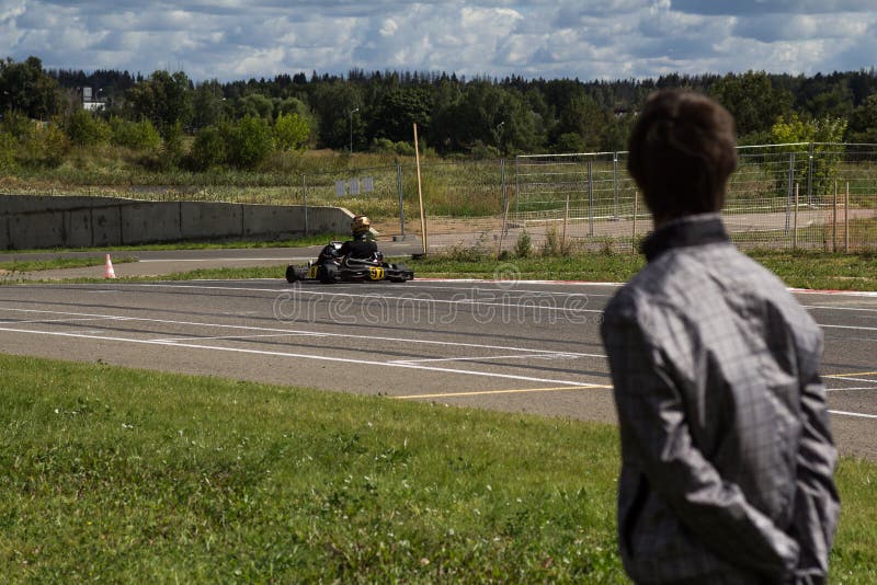 August 26, 2015 Moscow: trainer monitors the success of student in a go-kart race royalty free stock image August 26, 2015 Moscow: trainer monitors the success of student in a go-kart race royalty free stock image