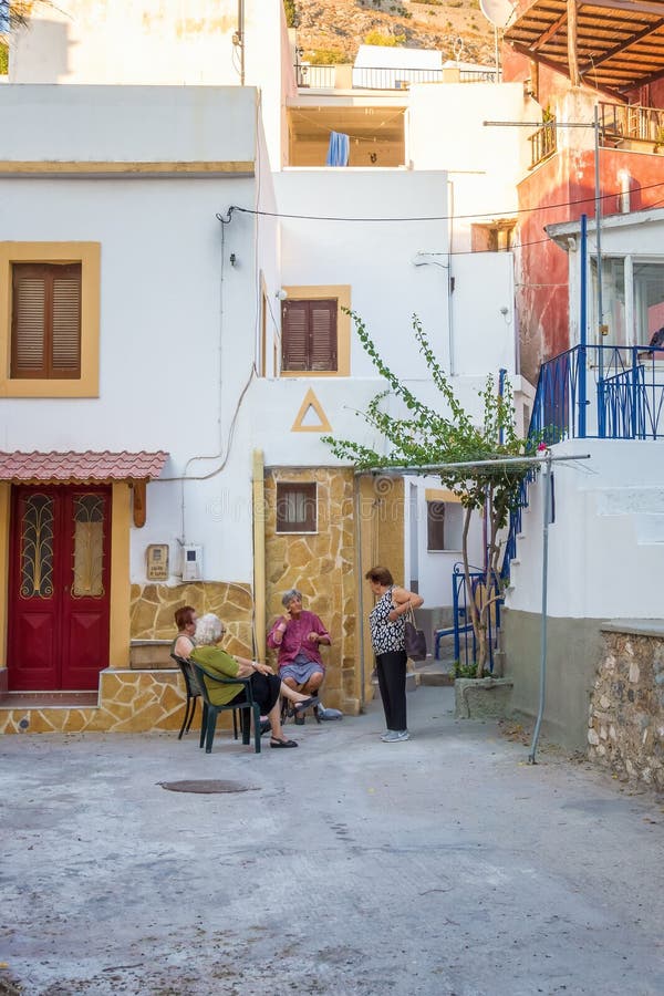 August 24th - Leros island, Greece - Elderly women enjoying the evening in Leros royalty free stock photo