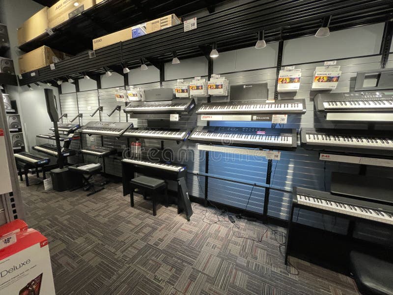 Guitar Center Retail Store Interior Keyboards Displayed on a Wall
