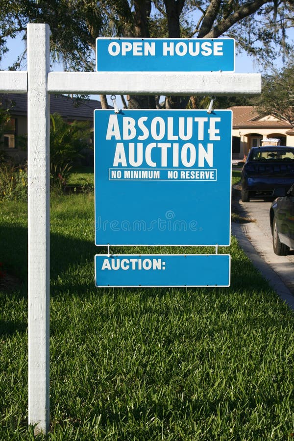 Blue and white Absolute Auction and Open House sign for house for sale. Blue and white Absolute Auction and Open House sign for house for sale