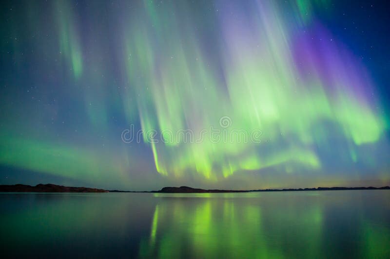 Aurora Borealis. The nature in Greenland is amazing. One of the amazing we get it northern lights. It comes when the sun gets low and the up time is only few stock photos Aurora Borealis. The nature in Greenland is amazing. One of the amazing we get it northern lights. It comes when the sun gets low and the up time is only few stock photos