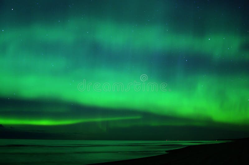 Night sky stars magic aurora polar lights over sea royalty free stock images Night sky stars magic aurora polar lights over sea royalty free stock images