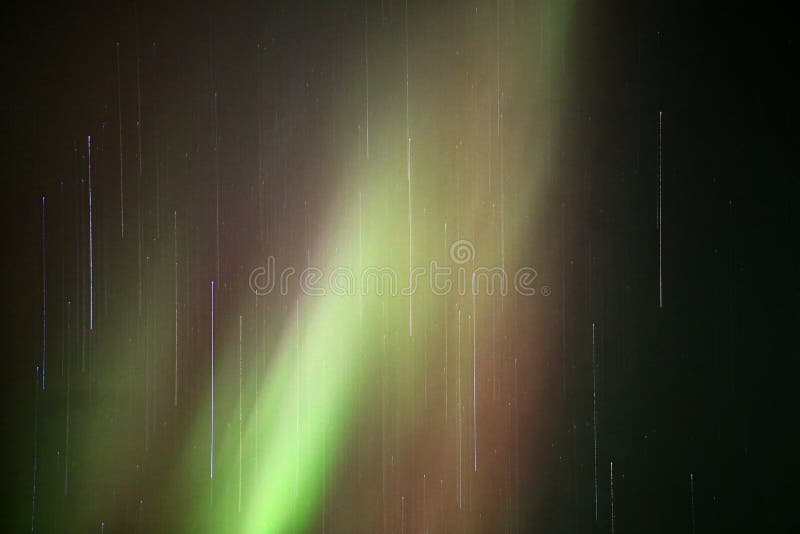 Aurora Borealis in Red and Green and Stars with Motion Blur Effect