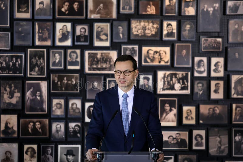 Auschwitz-Birkenau,Poland- 6 December 2019: speech of the Prime Minister Mateusz Morawiecki during chancellor Angela Merkel, German politician visit in Auschwitz- Birkenau German concentration camp. Auschwitz-Birkenau,Poland- 6 December 2019: speech of the Prime Minister Mateusz Morawiecki during chancellor Angela Merkel, German politician visit in Auschwitz- Birkenau German concentration camp