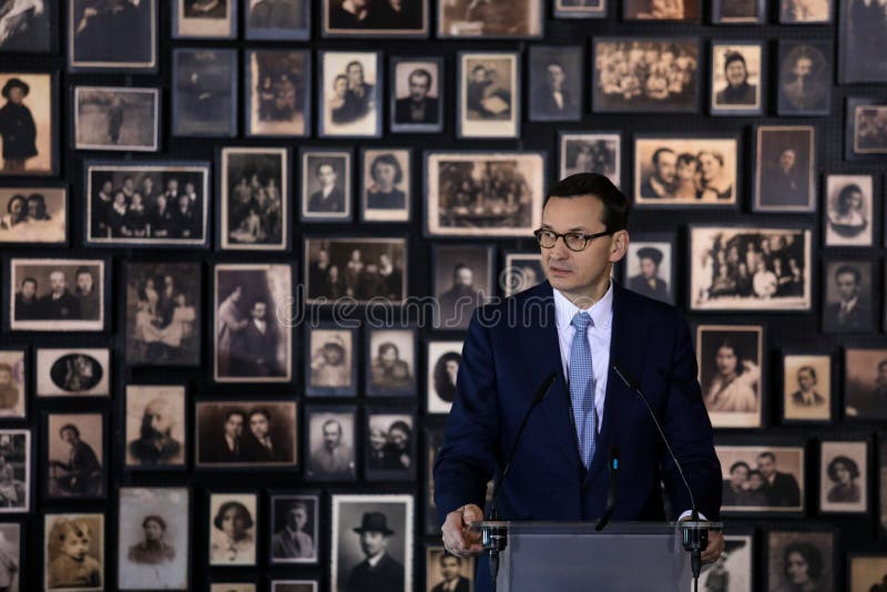 Auschwitz-Birkenau,Poland- 6 December 2019: speech of the Prime Minister Mateusz Morawiecki during chancellor Angela Merkel, German politician visit in Auschwitz- Birkenau German concentration camp. Auschwitz-Birkenau,Poland- 6 December 2019: speech of the Prime Minister Mateusz Morawiecki during chancellor Angela Merkel, German politician visit in Auschwitz- Birkenau German concentration camp