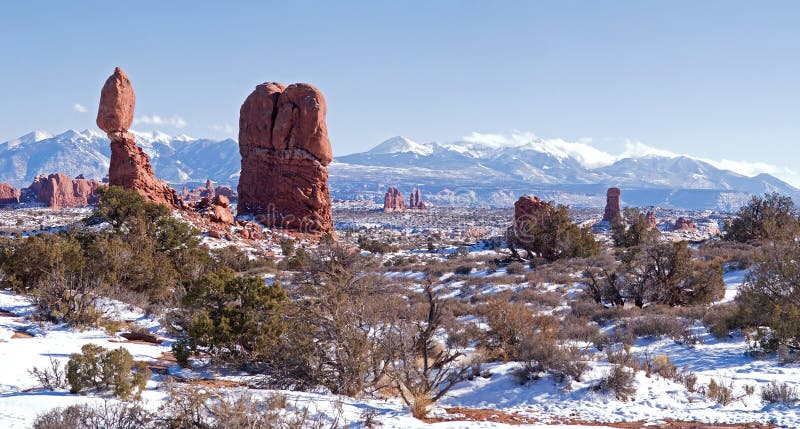 Balanced Rock in Arches National Park, with snow covered La Sal Mountains. Balanced Rock in Arches National Park, with snow covered La Sal Mountains.