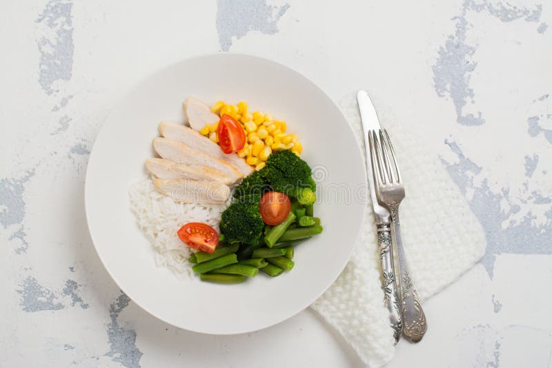 Balanced meal or diet concept. Chicken with rice and vegetables. Balanced meal or diet concept. Chicken with rice and vegetables